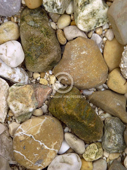 Pebbles under crystal clear water