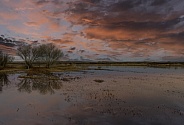 Sunset with beautiful color and clouds over a lake in New Mexico