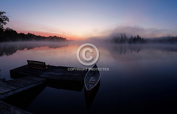 Pastel coloured clouds and mists on the lake