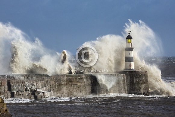 Waves crashing over Seaham Lighthouse