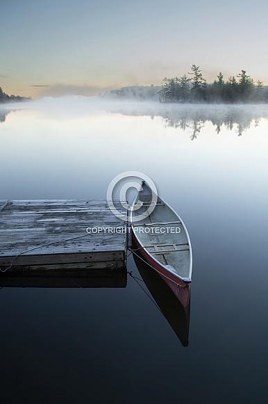 Mists and canoe